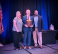 Mike accepts award