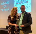 Mayor Jordan Marlowe accepts the Member of the Year Award from Chessie Flanders
