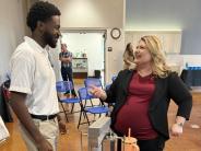U.S. Congresswoman Kat Cammack speaks with a MOOchanics co-founder at the beginning of the closing reception.