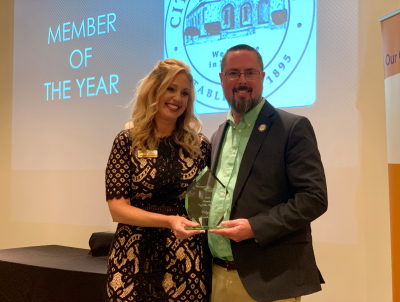 Mayor Jordan Marlowe accepts the Member of the Year Award from Chessie Flanders