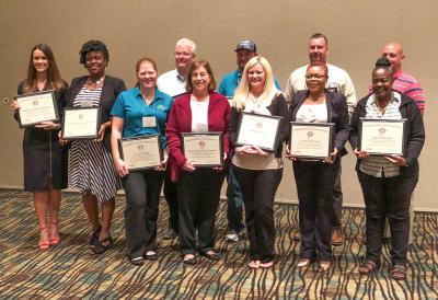 Image of award winners throughout the state of Florida holding their Building Strong Communities Award