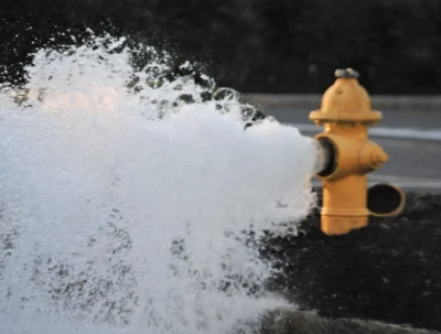 Fire hydrant being flushed